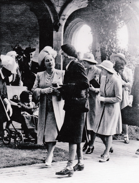 Winifred with back to the camera The Queen and the Princesses in the cloisters in June 1945